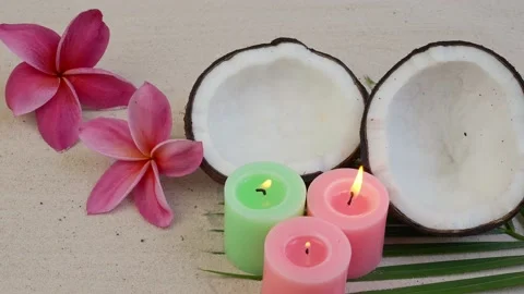 Burning Candles with coconut on sand beach. Stockbeeldmateriaal 201356535