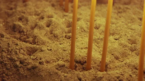 Burning candles in container with sand glide shot cu orthodox church Stock Footage 43556092