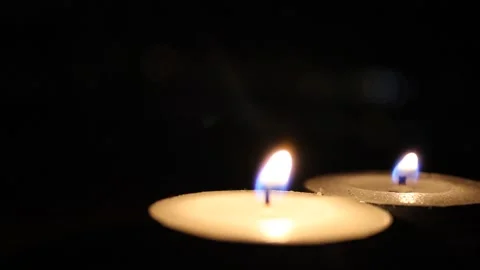 Burning candles in the dark Stock Footage 134696514