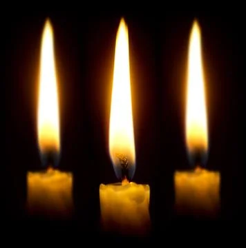 Burning candles in the dark Stock Photos