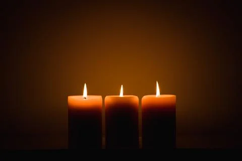 Burning candles in the dark Stock Photos