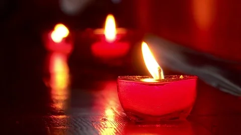 Burning candles. Flame of a candle. Reflection. Stock Footage 79321346