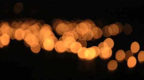 Burning candles float on water in Sukhothai, Thailand. Deep out of focus. Video stock 49537128