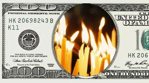 Burning candles in frame of 100 dollar bill Stock Footage 96724371