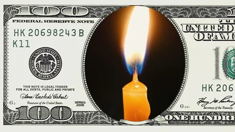 Burning candles in frame of 100 dollar bill Stock Footage 96724903