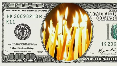 Burning candles in frame of 100 dollar bill Stock Footage 97601431