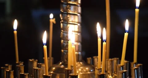 Burning candles in a gilded candlestick in the Orthodox church Stock Footage 207011747