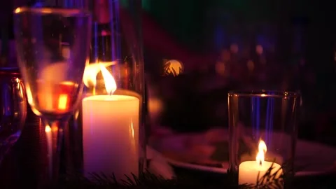 Burning candles in a glass flask on the table Stock Footage 156330598