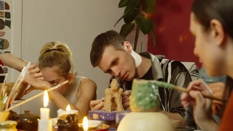 Burning candles at the modeling clay workshop add to the atmosphere. Stock Footage 250164720