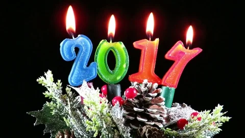 Burning candles for the new year , 2017, on winter  decoration Stock-Footage 70486359
