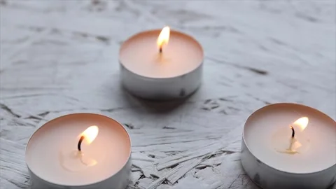 Burning candles with one being extinguished. Meditation, psychology Stock Footage 303079948