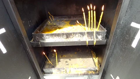Burning candles for prayer Stock Footage 139945606