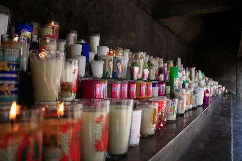 Burning candles of saints Stock Photos