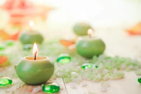 Burning candles salt spa Stock Photos