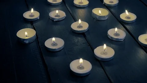 Burning candles spinning. Seamless looping Stock Footage
