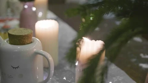 Burning candles standing on a Christmas table. 스톡 동영상 306870778
