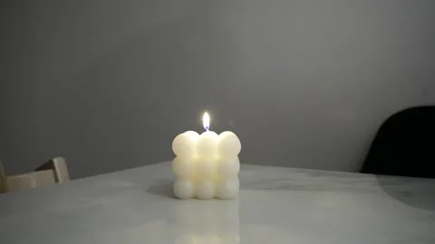 Burning candles on table smooth camera motion Video stock 323872801