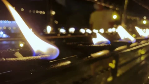Burning candles in the temple of the Tooth of the Buddha in Kandy, Sri Lanka Stock Footage 218319057