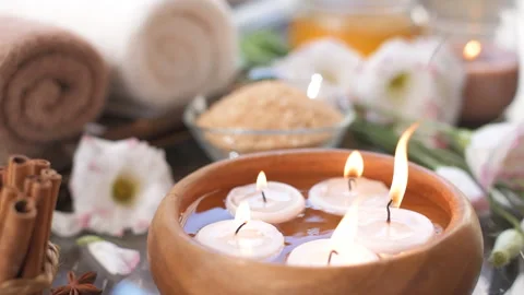 Burning candles in water. Composition of spa. Close-up. Stock Footage 92358404