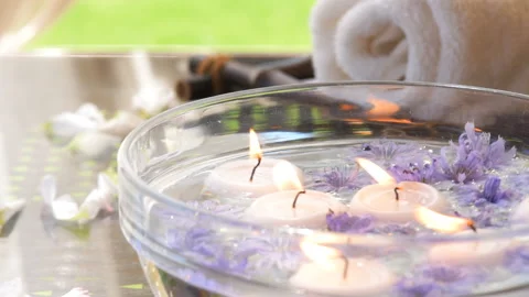 Burning candles in water. Composition of spa. 動画素材 92358662