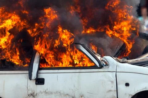 Burning car burning car - Exercise firefighters Stock Photos