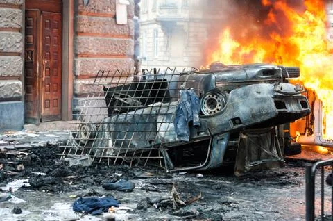 Burning car. car destroyed and set on fire during the riots. city center Stock Photos