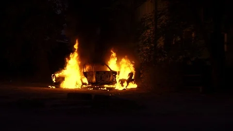 Burning car in flames of fire and arrived firefighters Stock Footage 115269525