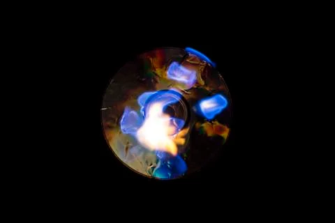 Burning CD blue flame Stock Photos