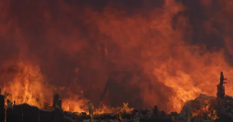 The burning, charred remains of a structure still on fire Stock Footage 59224832
