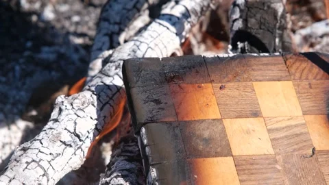 Burning chessboard. The chessboard is burning in the fire. Chessboard on fire Stock-Footage 278466172