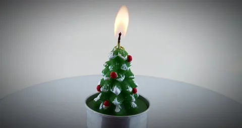 Burning christmas tree tee candle on spinning lazy susan turntable. 4k video 스톡 동영상 146263198