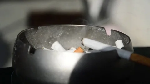 Burning cigarette in a ashtray. Closeup. Stock Footage 70198458
