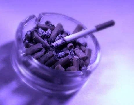 BURNING CIGARETTE IN ASHTRAY Stock Photos