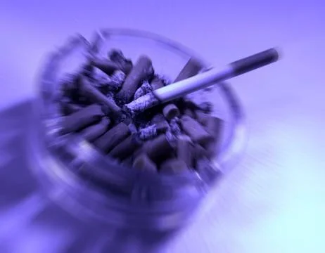 BURNING CIGARETTE IN ASHTRAY Stock Photos