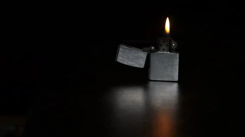 Burning cigarette lighter on a black background Stock Footage 48000414