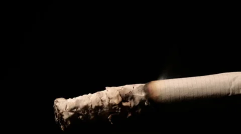 Burning Cigarette, macro time lapse on black background Stock Footage 33962666