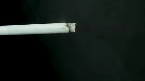 cigarette lighting sound effect Lighter Ignite Hand lighting lighter cigarette closeup....