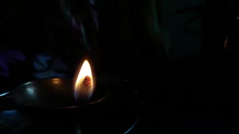 Burning clay lamp flame at night spiritual activity Stock Footage 130867304