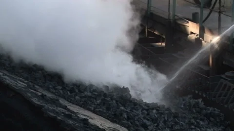 Burning coal is extinguished with water. Slow Motion Video stock 56812636