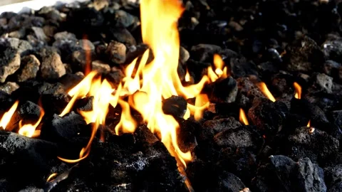Burning coal fire red hot coals close-up in 4k HD Stock-Footage 334651576