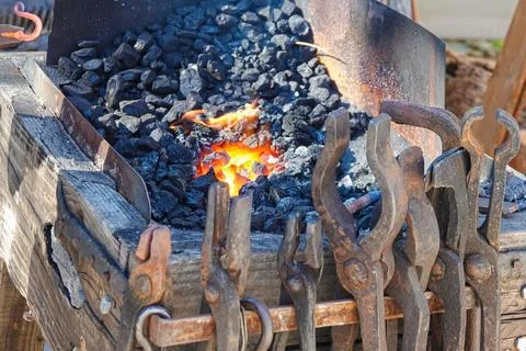 Burning in the coal forge and tool of farrier Stock Photos
