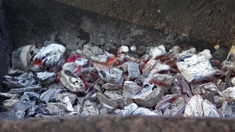 Burning coal in the grill Stock Footage 107683295