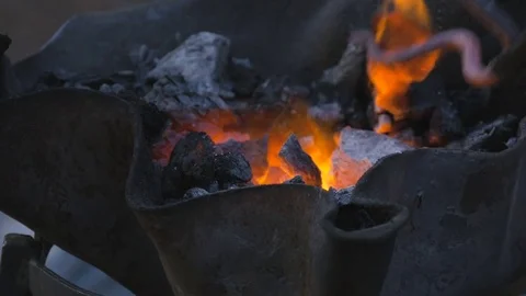 Burning coal in the hearth of a blacksmith Stock Footage