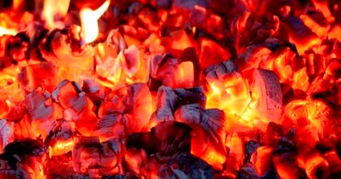 Burning coal, soft focus. Textures, background, abstract Stock Photos