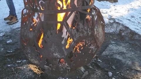Burning coals in a brazier. Maslenitsa celebration in the city park. Stock Footage 302171108