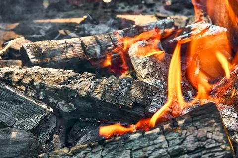 Burning coals covered by fire in the menhal, preparation of coals for grill.. Stock Photos