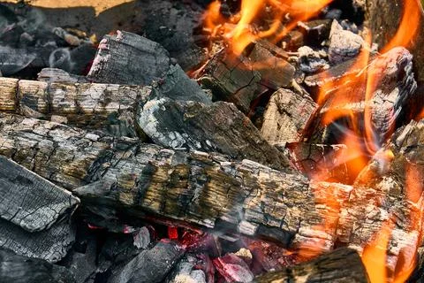 Burning coals covered by fire in the menhal, preparation of coals for grillin Stock Photos