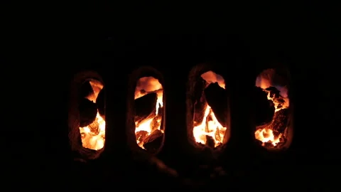 Burning Coals of Fireplace. View Through Shutter. Stock-Footage 97277919
