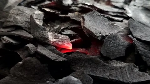 Burning coconut shell charcoal produces high heat which is ideal for cooking Stock Footage 336761942