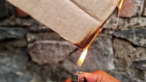 Burning Corrugated Cardboard Texture with Vibrant Orange Flames Video stock 333578893
